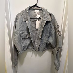 Distressed denim crop jacket NWT says S/M size, but could fit up to a large.